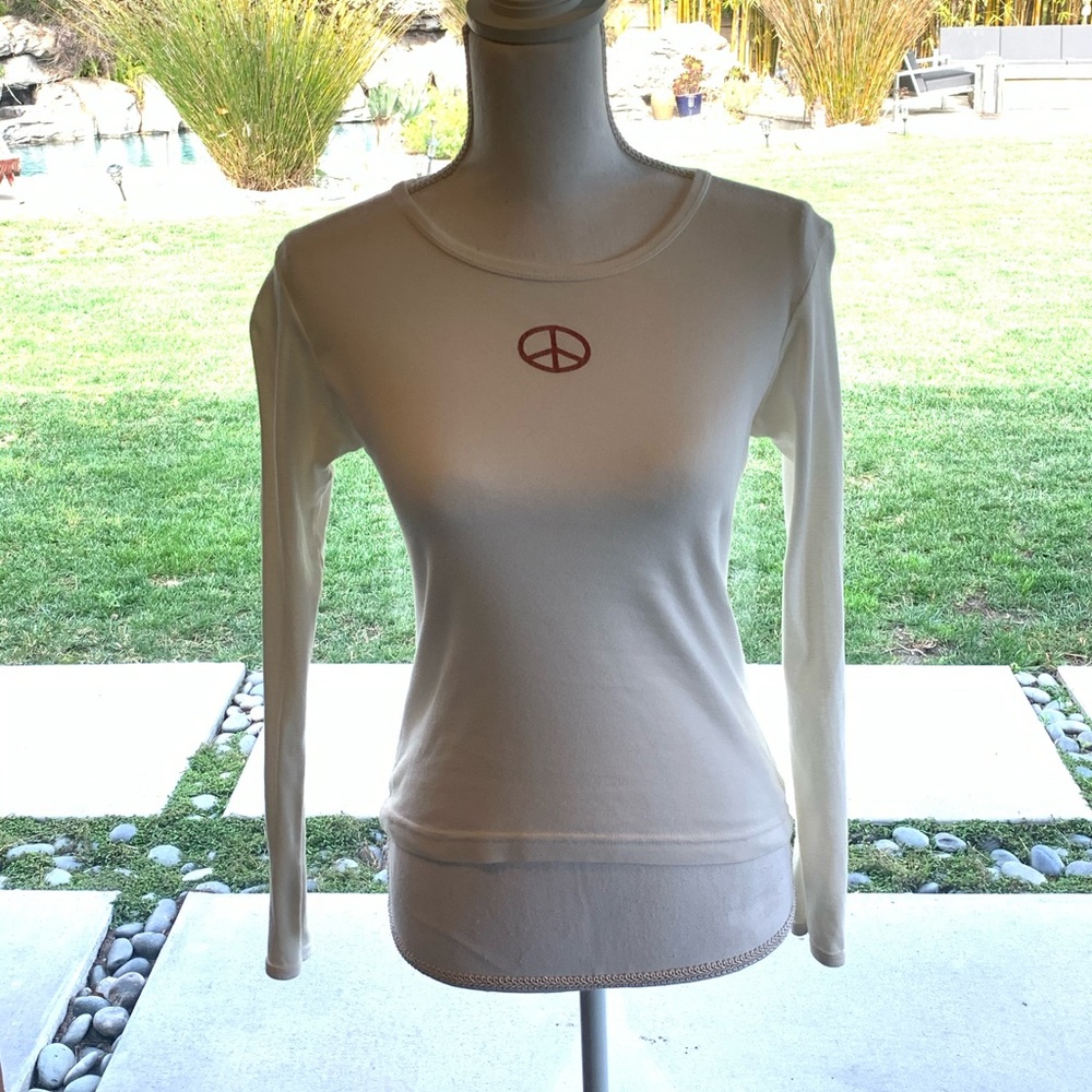 This is a white long sleeve from Sundance